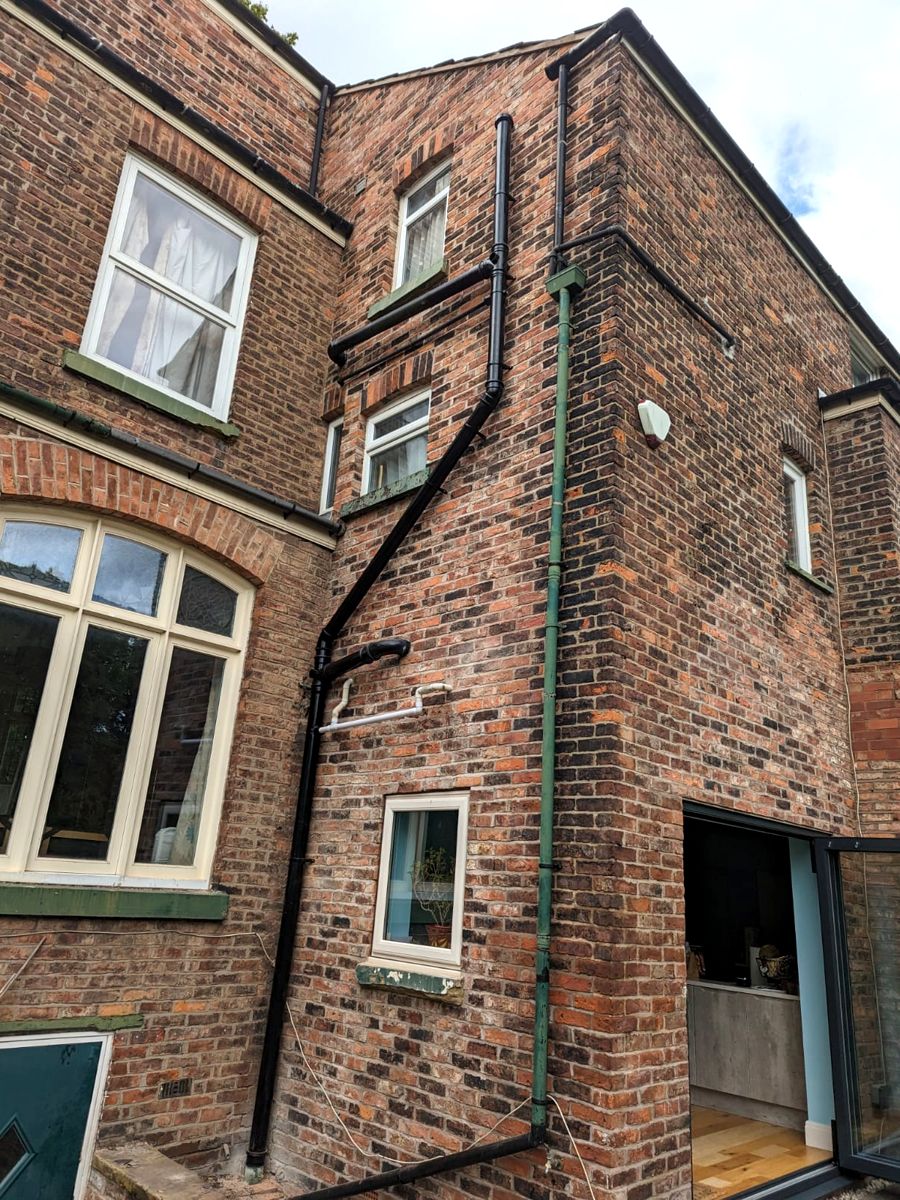 New PVC soil stack fitted on a brick house